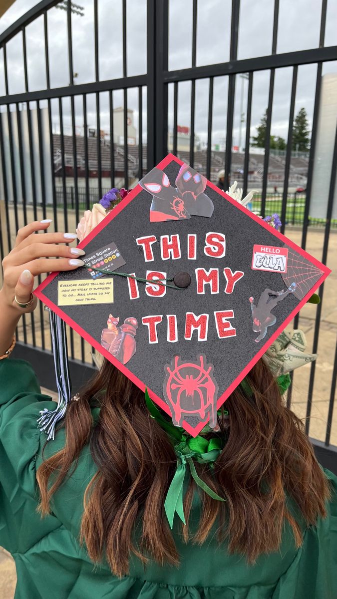 a woman wearing a graduation cap that says, this is my time