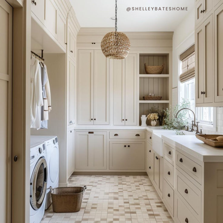 a laundry room with white cabinets and checkered tile flooring is seen in this image