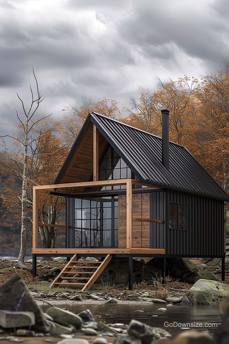 a small cabin sits in the middle of some rocks