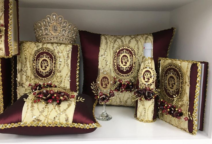 decorative pillows and pillow cases are arranged on a shelf