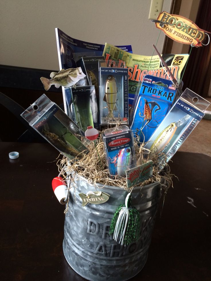 a bucket filled with assorted items on top of a table