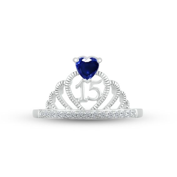 Make her feel majestic on her special day with this sparkly crown ring crafted in sterling silver. A heart-shaped blue lab-created sapphire – the birthstone of September – shines atop the design. The number 15 gleams inside the heart-shaped center, while a line of white lab-created sapphires shimmer on the band to finish the look. Cubic Zirconia Birthstone Ring For Birthday, Heart Shaped Blue Jewelry For Birthday, Elegant Blue Rings For Birthday, Silver Jewelry For Sweet 16 And Valentine's Day, Blue Jewelry For Birthday And Valentine's Day, Blue Birthstone Ring For Birthday, Quinceanera Crown, Number 15, Quince Ideas