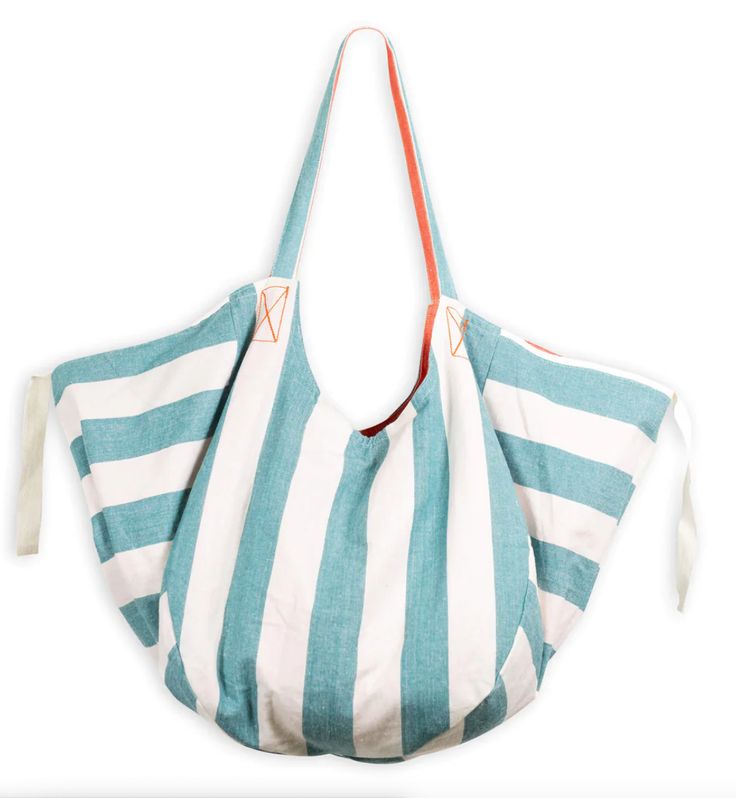 The Gemini Reversible Tote is the perfect accessory for your summer adventures. Made with crisp cotton and lined with an interior pocket, this tote bag is both stylish and functional. The best part? The Gemini Reversible Tote is two bags in one, with reversible solid and stripes to mix and match with your favorite summer looks. Summer Cotton Shoulder Bag For Travel, Summer Beach Bag With Pockets For Everyday, Summer Cotton Bags With Pockets, Summer Cotton Bag With Pockets, Reversible Blue Shoulder Bag With Double Handle, Blue Reversible Shoulder Bag With Double Handle, Summer Reversible Cotton Shoulder Bag, Reversible Blue Tote Shoulder Bag, Blue Reversible Tote Shoulder Bag