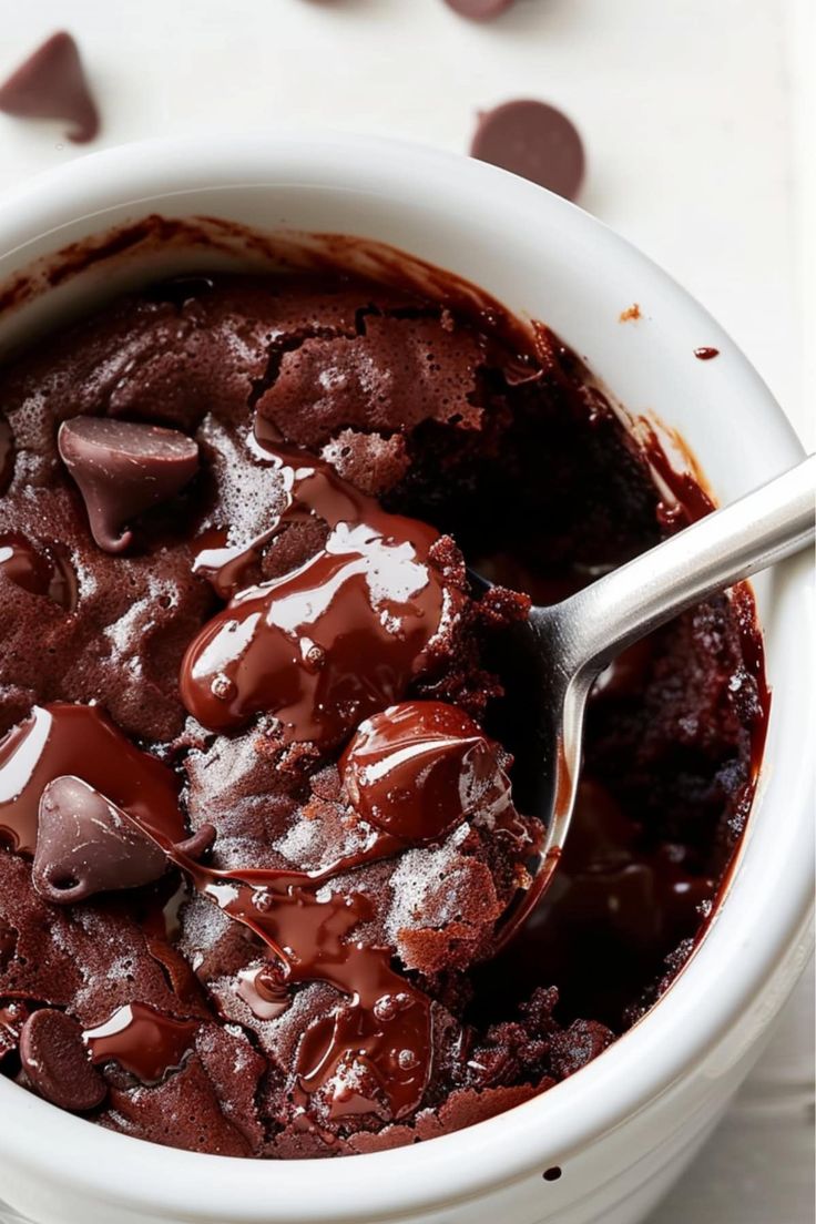 a white bowl filled with chocolate pudding and ice cream