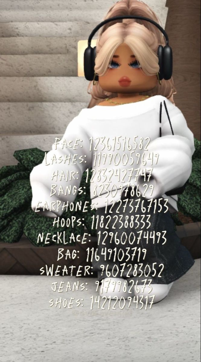 a doll with headphones sitting on some steps