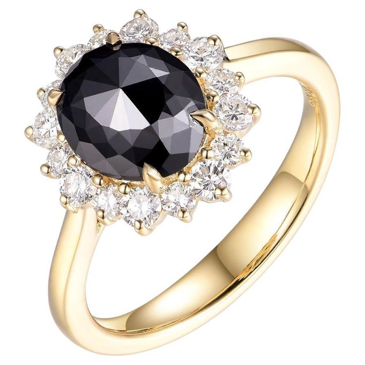 a black and white diamond ring with diamonds around the band, set in 18k yellow gold