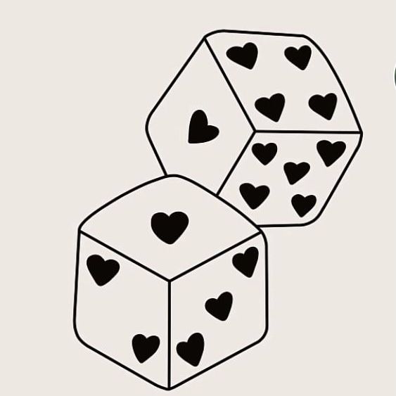 two dices with hearts on them sitting next to each other