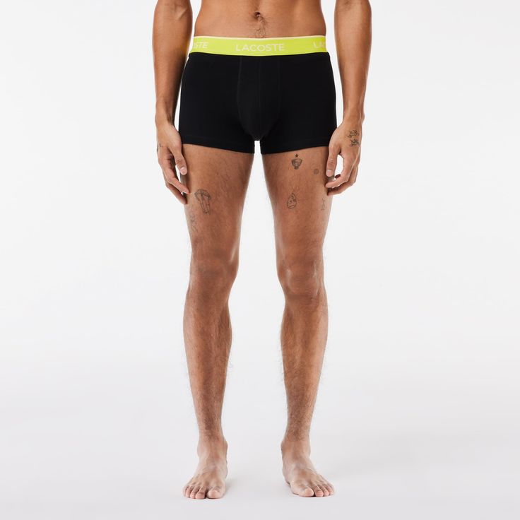 Crafted in comfortable soft stretch cotton which offers breathability and freedom of movement. These everyday essentials feature a contrasting waistband with white Lacoste brand name pattern. Pack comprising three plain-colored trunks. Sporty Summer Boxer Briefs With Logo Waistband, Stretch Cotton Boxer Briefs For Gym, Sporty Cotton Stretch Boxer Briefs, Sporty Boxer Briefs With Ribbed Waistband, Sporty Boxer Briefs With Ribbed Waistband For Sports, Stretch Cotton Boxer Briefs Multi-pack, Stretch Cotton Boxer Briefs In Athleisure Style, Stretch Cotton Multi-pack Boxer Briefs, Stretch Cotton Boxer Briefs Athleisure Style