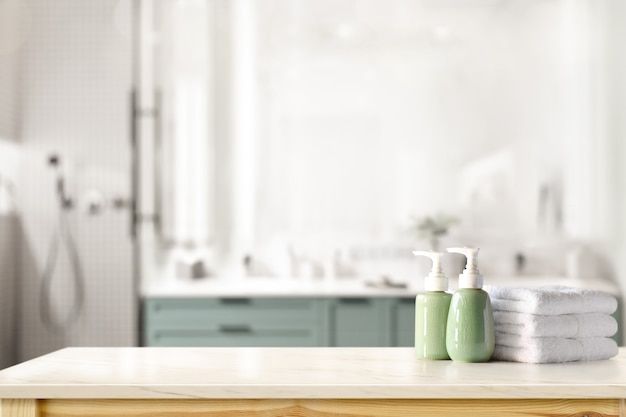 two soap dispensers sitting on top of a wooden table in a bathroom