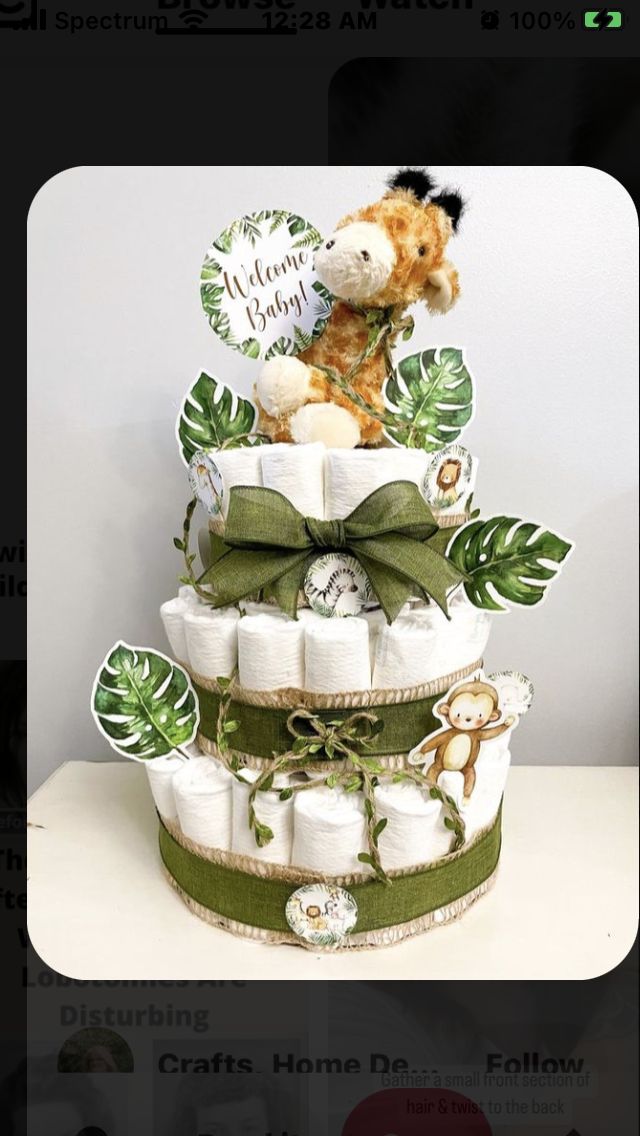 a diaper cake made to look like a giraffe on top of it