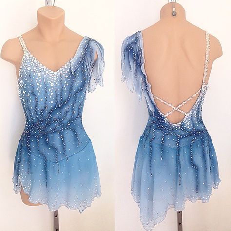 the back of a blue dress with white beads on it and an open neckline