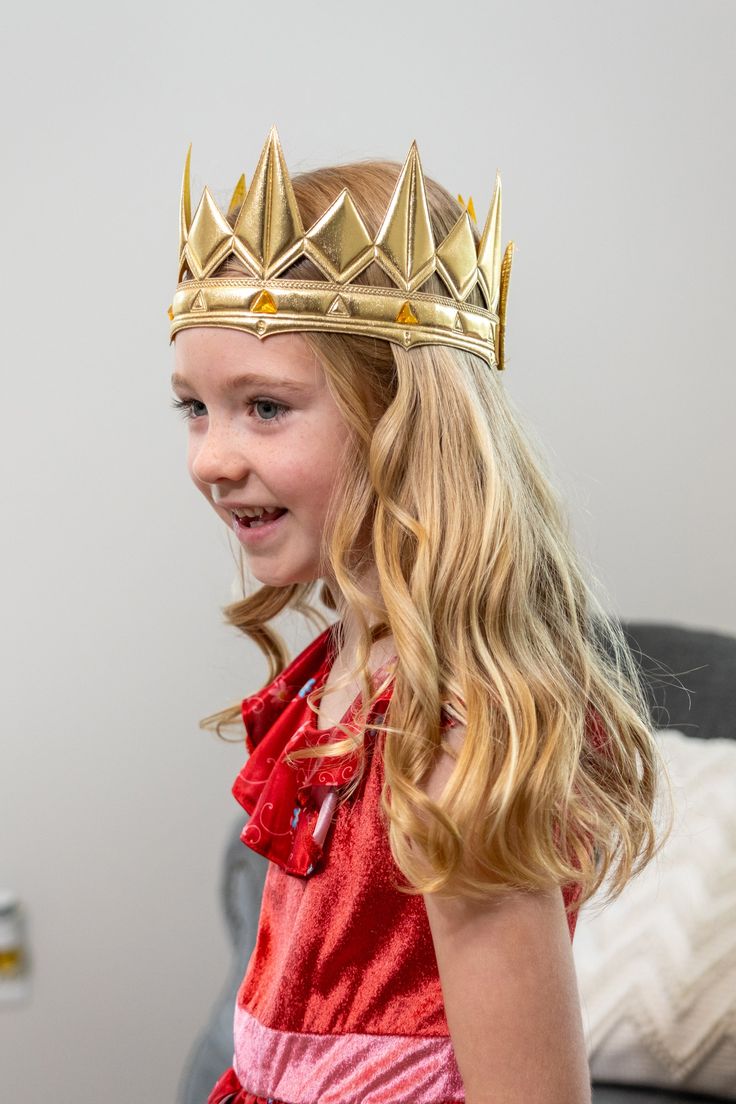 This regal Gold Medieval Crown is the perfect addition to our Prince Charming and Knight dress ups, or as a stand alone play accessory! One Size Fits Most Fabric crown with a soft foam center, designed for flexibility and made to last Fastens with a quality hook and loop closure, easy for adjusting to get a secure fit Easy for kids to put on and take off by themselves D esigned to coordinate with our adventure dress ups Adjustable Crown For Cosplay, Adjustable Gold Costume Accessories For Cosplay, Adjustable Tall Crown Costume Accessories For Parties, Adjustable Tall Crown For Costume, Adjustable Crown Costume Accessories For Costume Party, Knight Dress, Adventure Dress, Medieval Crown, Fabric Crown