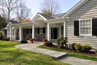 a house with black shutters and white trim