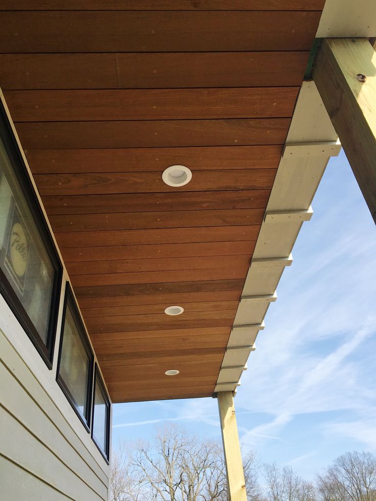 an outside view of a house with wood siding