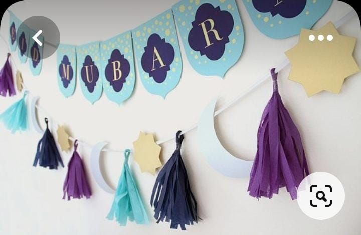 a party banner with tassels hanging from it