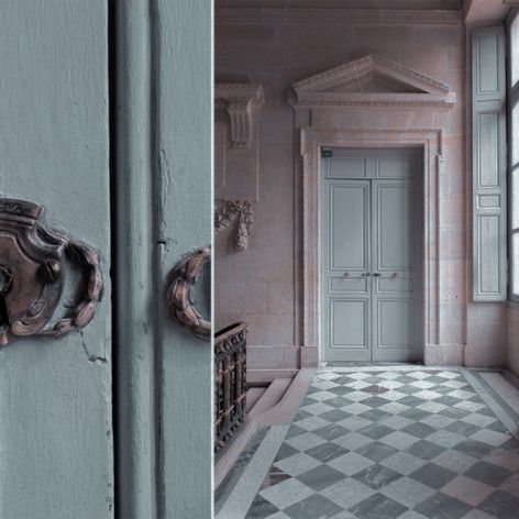 an old door is open and there are two doors in the same room, one has a checkerboard floor