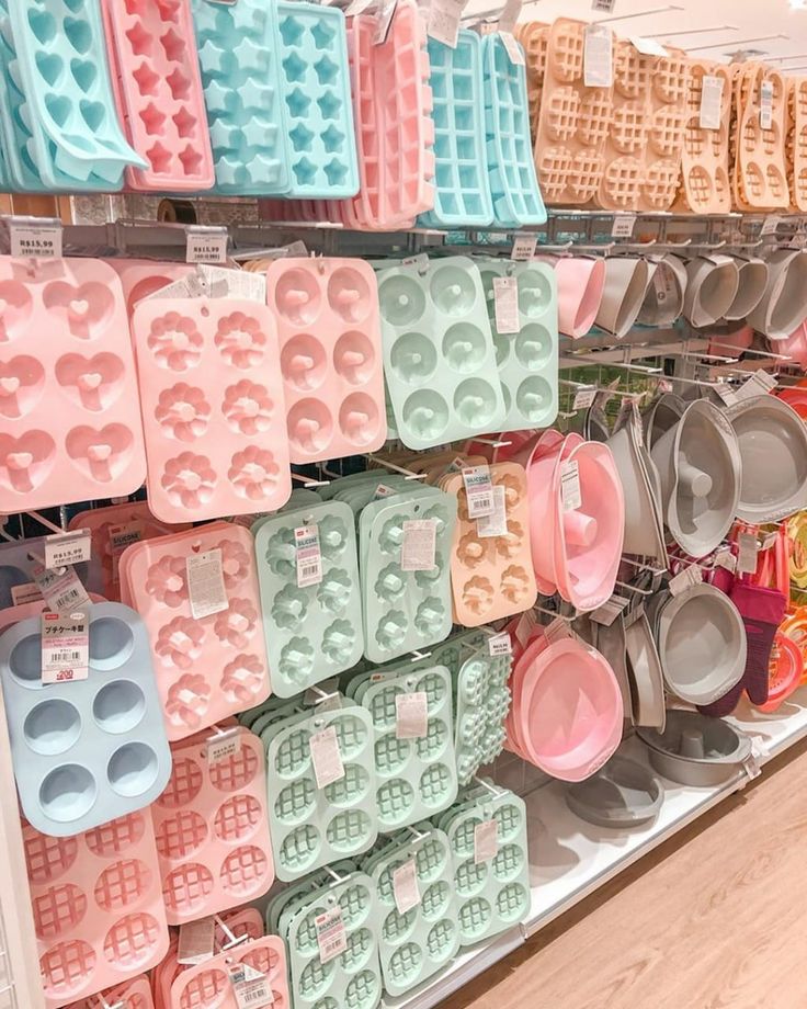 the shelves are filled with different types of waffles and pans for sale