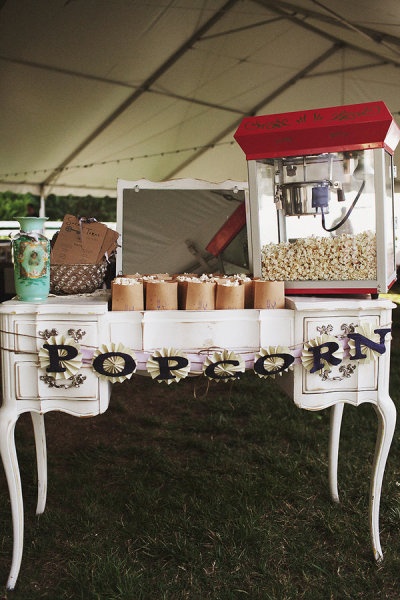 an old fashioned vanity with popcorn on the top and mirror above it in a tent