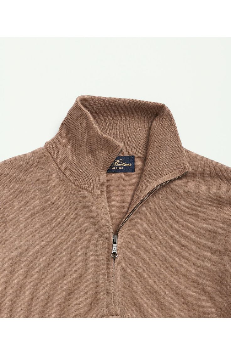 Classic and comfortable, this all-wool sweater styled in a camel-hued neutral features a taller collar for extended coverage and a lightweight feel that works layered or on its own. 27 1/2" length Half-zip closure Stand collar Long sleeves Ribbed cuffs and hem 100% wool Hand wash, dry flat Imported Classic Wool Funnel Neck Polo Sweater, Classic Neutral Tops For Winter, Winter Beige Cashmere Polo Sweater, Beige Cashmere Polo Sweater For Winter, Classic Winter Sweater In Neutral Color, Casual Merino Wool Outerwear With Funnel Neck, Brown Merino Wool Sweater For Work, Beige Merino Wool Sweater For Fall, Fitted Beige Merino Wool Outerwear