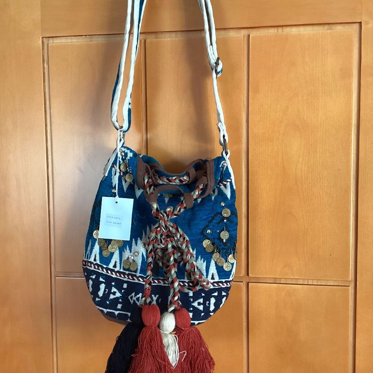 Nwt Boho Tribal Beach Bag With Adjustable Strap Accented With Colorful Tassels And Gold Coins Casual Beach Shoulder Bag With Removable Pouch, Casual Hobo Bag With Removable Pouch For Vacation, Casual Vacation Pouch Shoulder Bag, Casual Pouch Shoulder Bag For Vacation, Casual Beach Bag With Removable Pouch For Vacation, Vacation Hobo Shoulder Bag With Removable Pouch, Multicolor Bucket Bag With Adjustable Strap For Vacation, Multicolor Vacation Bucket Bag With Adjustable Strap, Bohemian Crossbody Bucket Bag With Adjustable Strap