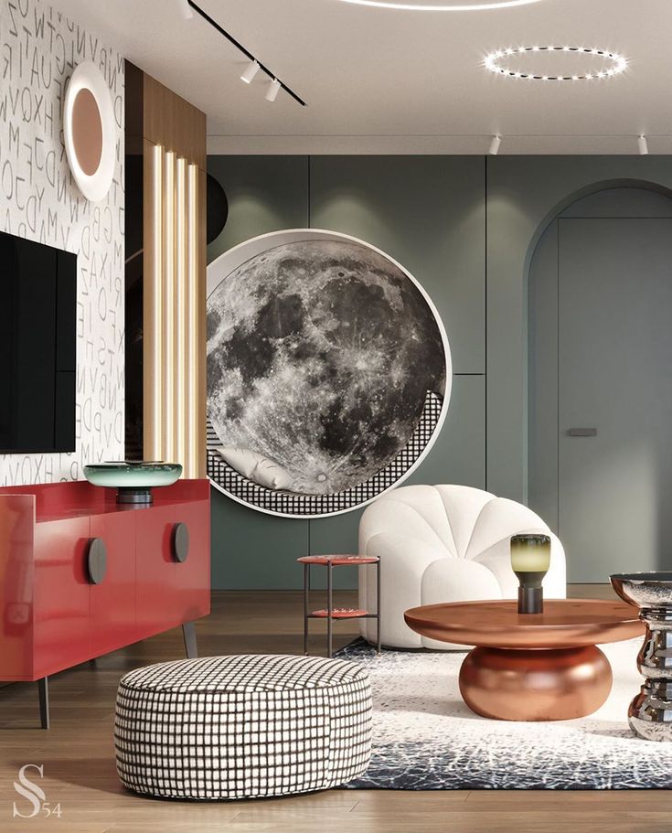 a living room filled with furniture and a large moon hanging on the wall above it