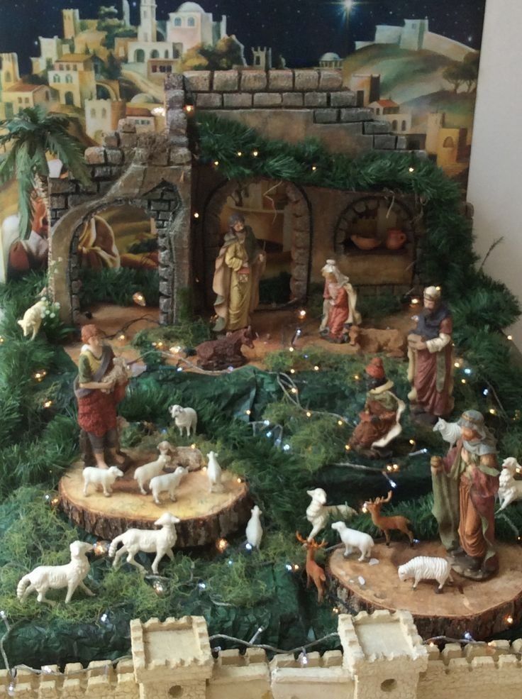 a nativity scene with figurines and lights