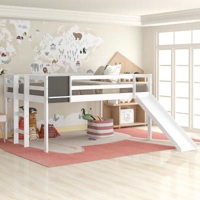 a child's bedroom with a bunk bed and slide