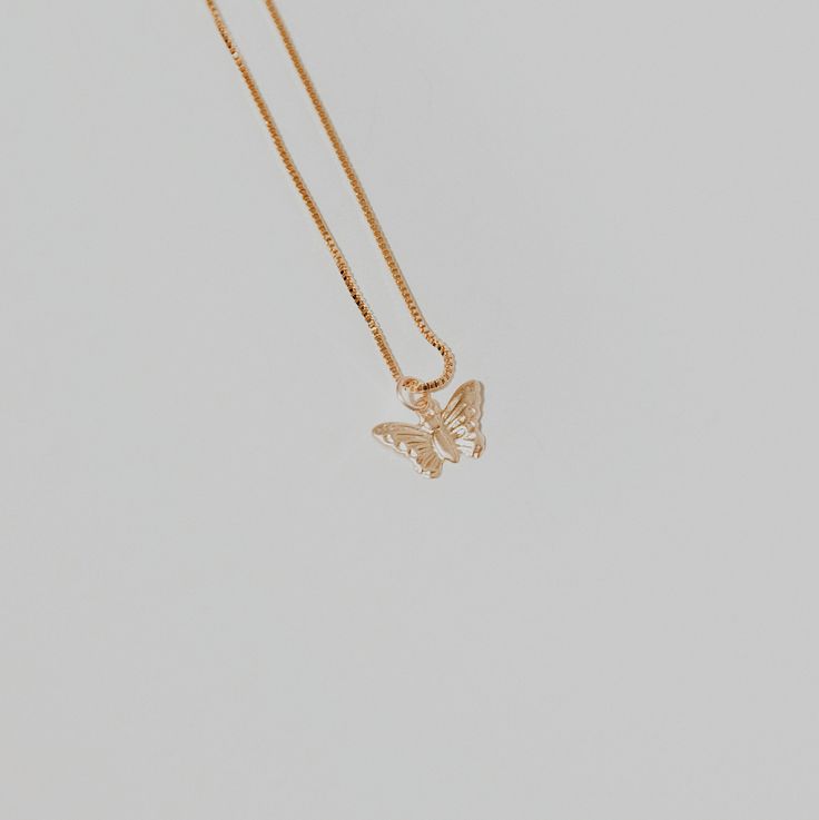 This butterfly necklace will add a delicate touch to any look with its chain and pendant. Treat yourself or a loved one to a unique piece of jewelry today! ∙ D E T A I LS ∙- 18k Gold Filled- 18 inches in length- Box Chain - Hypoallergenic (lead + nickel free) ∙ G O L D ∙ F I L L E D ∙ Gold-filled components contain 100+ times more real gold than gold-plated components and are both durable and tarnish resistant. It is more affordable and accessible than solid gold but higher quality than gold plated. Butterfly Shaped Rose Gold Jewelry Gift, Hypoallergenic Yellow Gold Butterfly Jewelry, Butterfly Shaped Rose Gold Jewelry For Gifts, Hypoallergenic Butterfly-shaped Yellow Gold Jewelry, Hypoallergenic Butterfly Yellow Gold Jewelry, Rose Gold Butterfly Jewelry Gift, Rose Gold Butterfly Jewelry For Gifts, Butterfly Shaped Necklace With Adjustable Chain For Gift, Gold Jewelry With Butterfly Charm For Gift