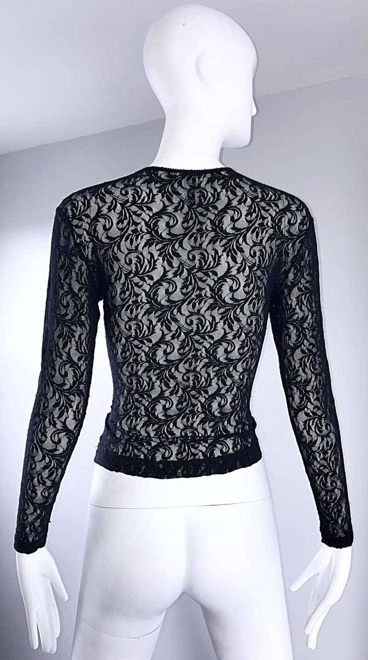 For Sale on 1stDibs - Sexy vintage 90s CALVIN KLEIN black lace cropped top shirt ! Features a fine soft lace that stretches to fit. Tailored body, with sleek long sleeves. Looks Black Lace Tops For Party, Black Lace Party Tops, Elegant Cropped Top With Delicate Lace, Evening Tops With Lace Sleeves And Stretch, Stretch Tops With Lace Sleeves For Evening, Fitted Top With Lace Sleeves For Night Out, Evening Stretch Lace Top, Evening Lace Tops With Stretch, Elegant Sheer Cropped Top