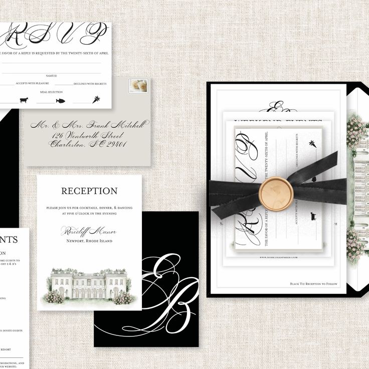 the wedding stationery is laid out on top of each other, including black and white paper