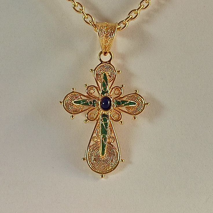 Handmade filigree Greek Orthodox Cross with enamel made of 18 carat yellow gold The Cross consists of two different pieces . The basic Cross witch is adorned with different filigree work spirals, and the upper part The second Cross is adorned with green and blue enamel The Cross is made in Greece in one of the oldest jewelry workshop that specializes in making filigree work jewelry specifically Greek style Crosses Ideal for baptism or any other special occasion ( The price does not include the c Greek Orthodox Cross, Ancient Greek Coin, Orthodox Cross, Greek Coins, Clip On Charms, Jewelry Workshop, Solid Gold Chains, Greek Orthodox, Greek Style