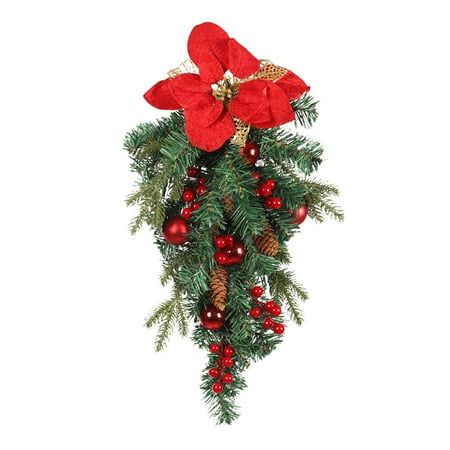 a red poinsettia hanging from a christmas tree with berries and pine cones