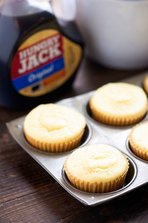 cupcakes sitting in a muffin tin on a table