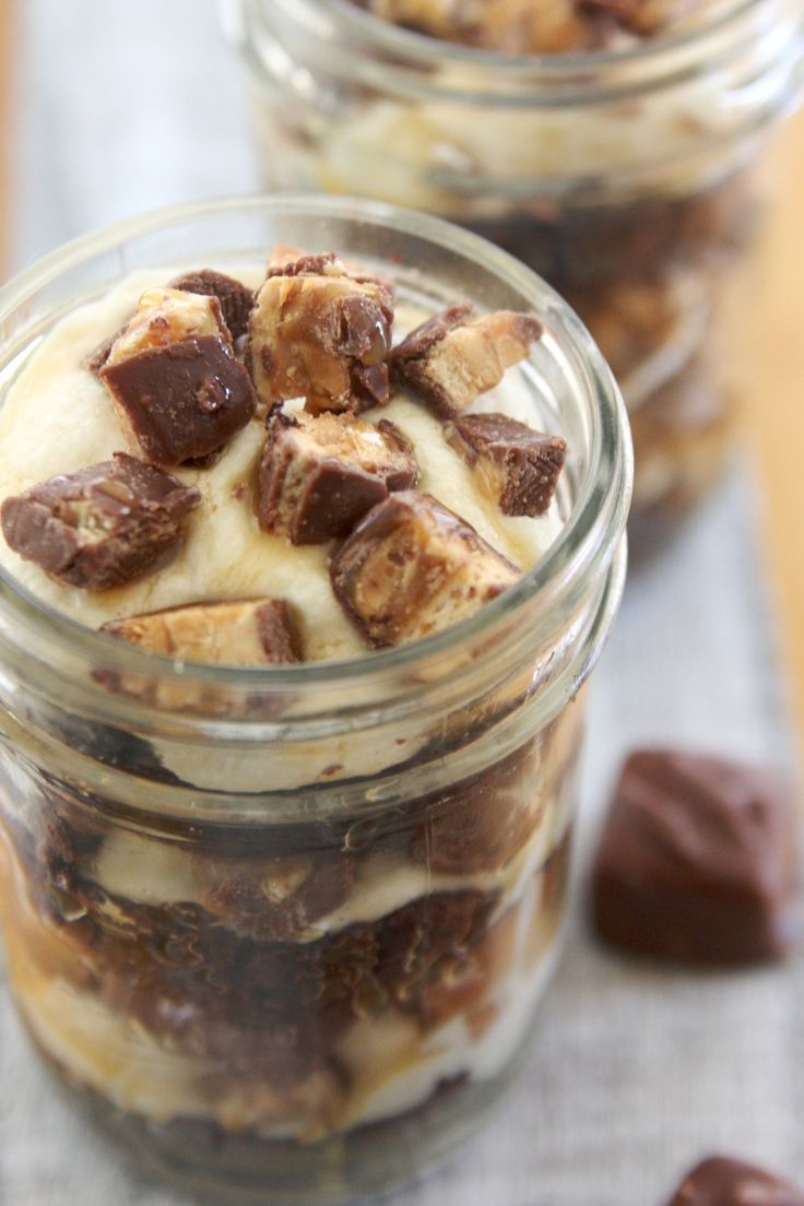 a glass jar filled with chocolate and marshmallows