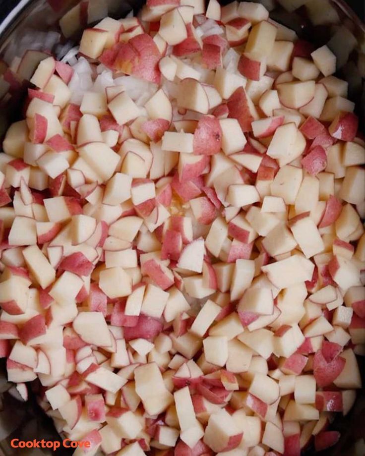 chopped up apples in a pot on the stove top, ready to be used as an appetizer