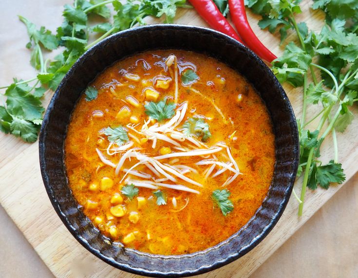 a bowl filled with soup and garnished with cilantro