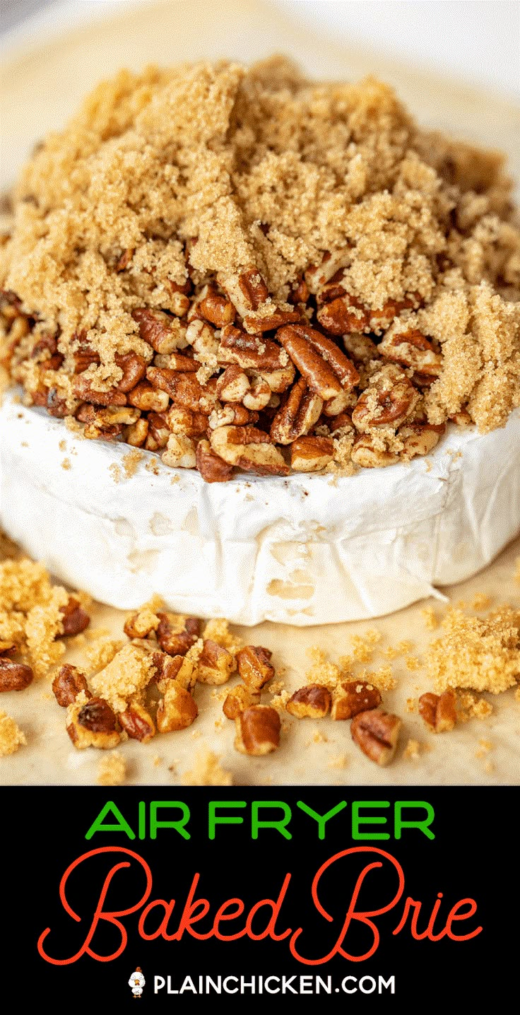 an air fryer baked brie with pecans and crumbs on top