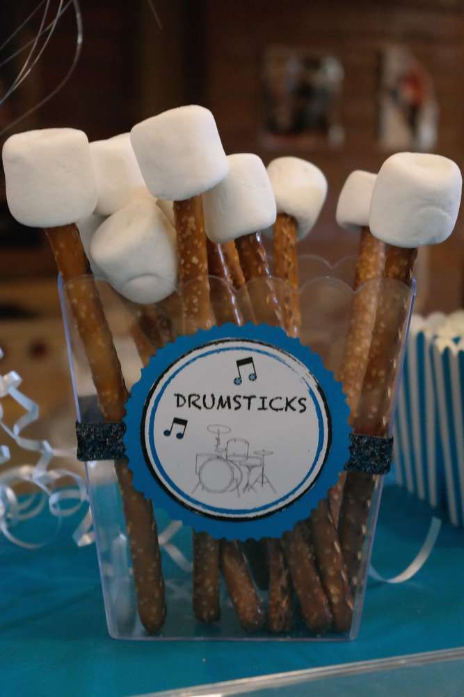 there are some sticks with marshmallows in them on top of the table