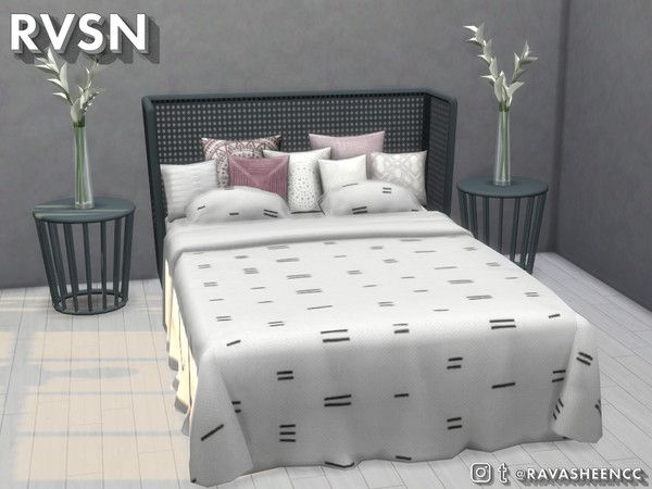 a bedroom with a bed, nightstands and two planters