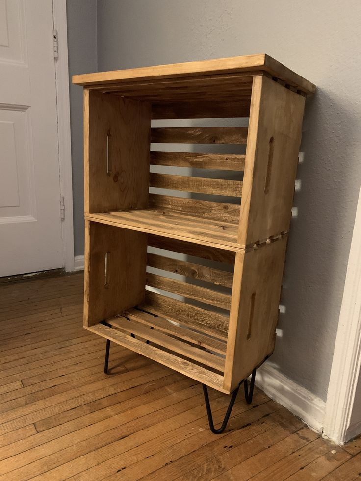 a wooden cabinet sitting on top of a hard wood floor