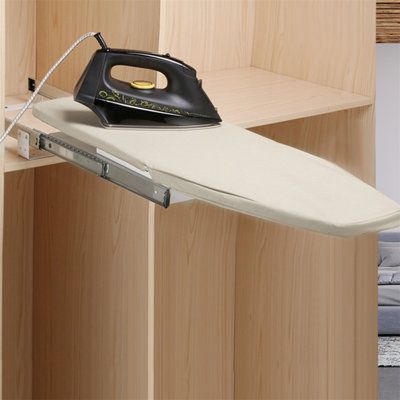 an ironing board is sitting on top of a wooden shelf