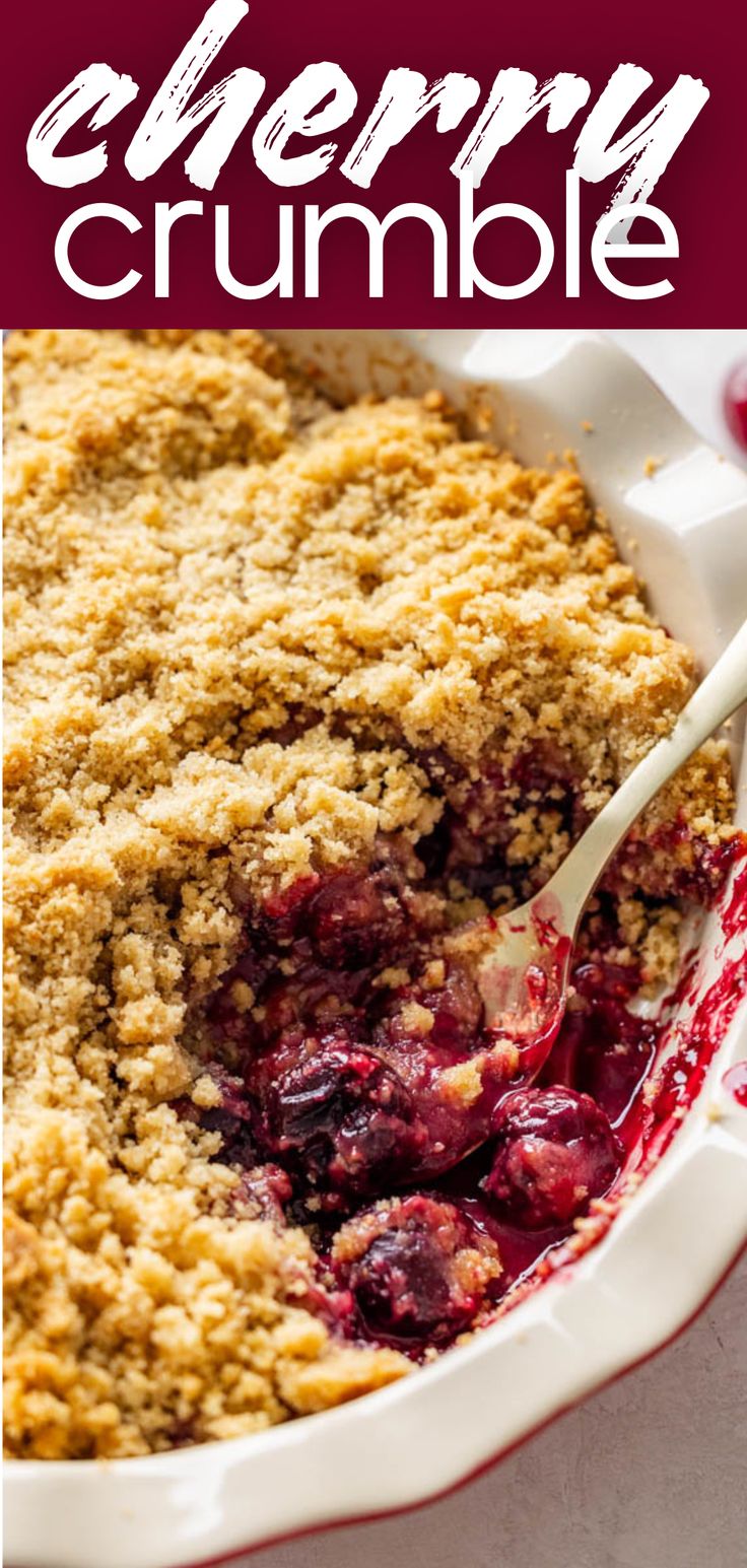 A close up view of a pan of cherry crumble with a spoon sticking out. Cherry Cobbler Fresh Cherries, Cherry Crisp Recipe With Canned Cherries, Cherry Crumble Pie Recipe, Cherry Crisp Recipe With Frozen Cherries, Sour Cherry Crumble, Fresh Cherry Crisp Recipe, Berry Crisp Recipe Crumble Topping, Cherry Crisp With Frozen Cherries, Cherry Pie Crumble Topping Recipe