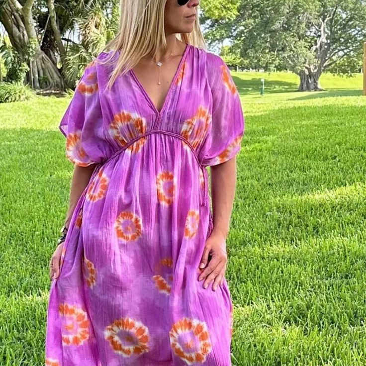 Kaftan Dress With V-Neck And Short Sleeves. Adjustable Woven Finish With Side Ties. Matching Interior Lining. Available In Sizes Xs-S And M-L Adjustable Side Straps 100% Cotton Pink Floral Print V-neck Dress For Summer, Pink Short Sleeve V-neck Dress For Beach, Multicolor Short Sleeve V-neck Dress For Vacation, Multicolor V-neck Beach Dress, Bohemian Multicolor V-neck Dress With Short Sleeves, Pink V-neck Sundress For Beach, Pink Short Sleeve V-neck Dress For Vacation, Pink V-neck Sundress, Casual Pink V-neck Dress For Vacation