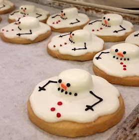 decorated cookies are lined up on the table