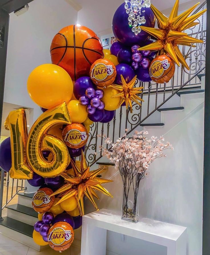 balloons and streamers are arranged in the shape of a basketball, with the number 15 on it