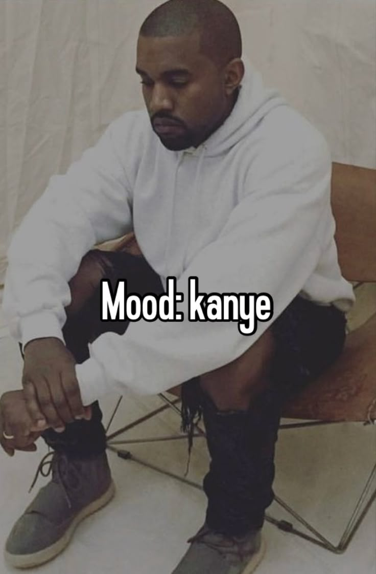 a man sitting on top of a chair with the words mood kanye in front of him