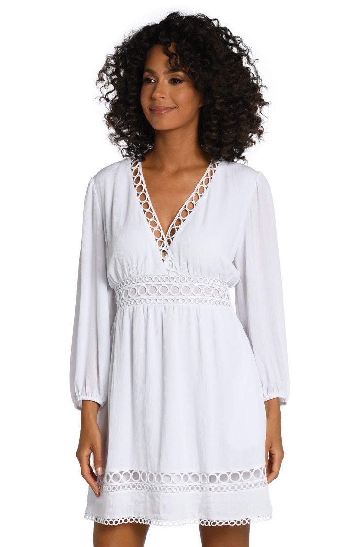 This dress gets its boho-chic vibe from crocheted details, pom-pom trim and casually cool crinkled fabric. Style with a V-neck and breezy bell sleeves, it can be worn as a dress or a cute cover-up that's ready for anything, from pool parties to music festivals. [split] Details V-neck dress Keyhole closure in back Hits above the knee Side pockets Fabric 100% Rayon Crinkle V-neck Beach Dress With Lace Trim, V-neck Beach Dress With Lace Trim As Cover-up, Flowy V-neck Boho Dress With Lace Trim, V-neck Dress With Lace Trim For Vacation, Spring V-neck Crochet Dress With Crochet Trim, Breezy V-neck Beach Dress For Daywear, Bohemian V-neck Dress With Crochet Trim, Chic V-neck Crochet Dress For Day Out, V-neck Vacation Dress With Lace Trim