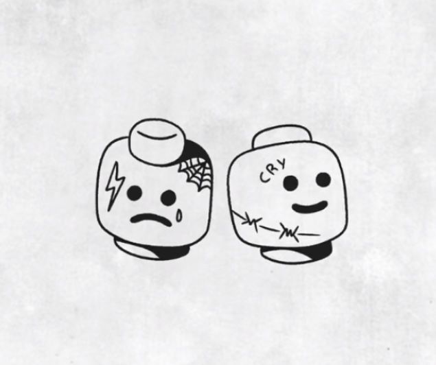 two cartoon heads with faces drawn on them, one is frowning and the other has an angry face