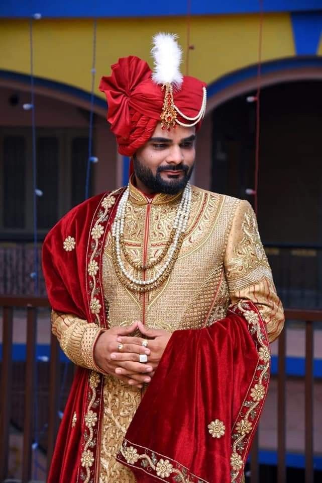 a man wearing a red and gold outfit