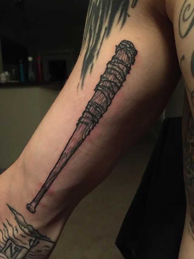 a man's leg with a tattoo on it